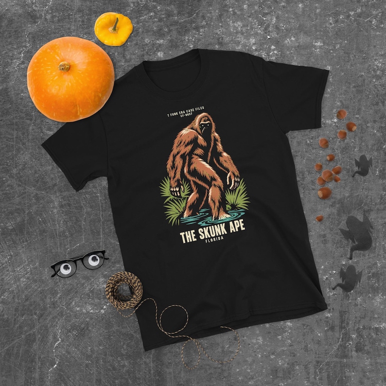 Black Case File CF-0057 T-shirt showing the Skunk Ape in a Florida swamp